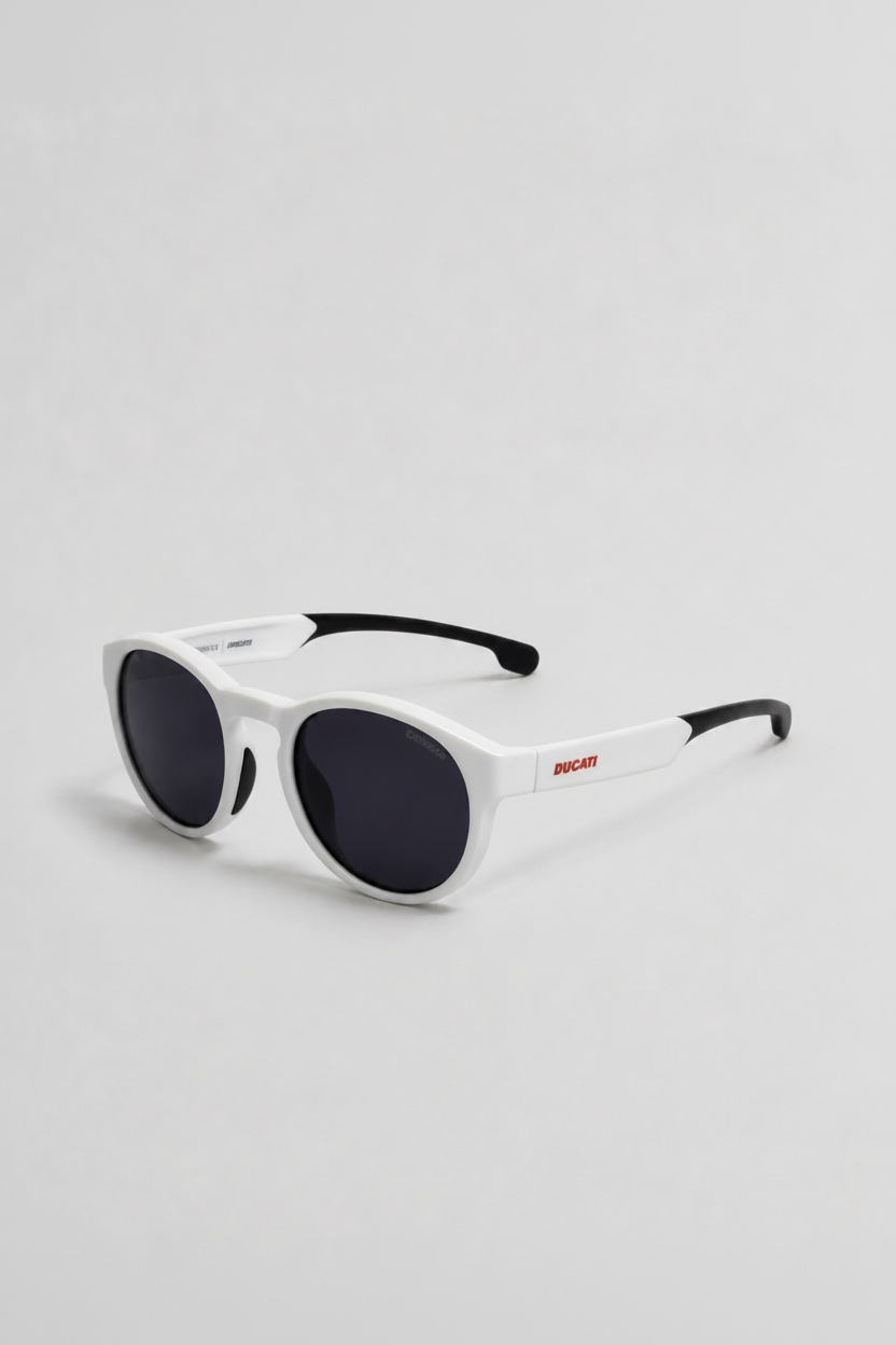 White round-frame sunglasses with dark lenses and black temple tips, featuring a small red DIXI logo on the side, shown on a light gray background.