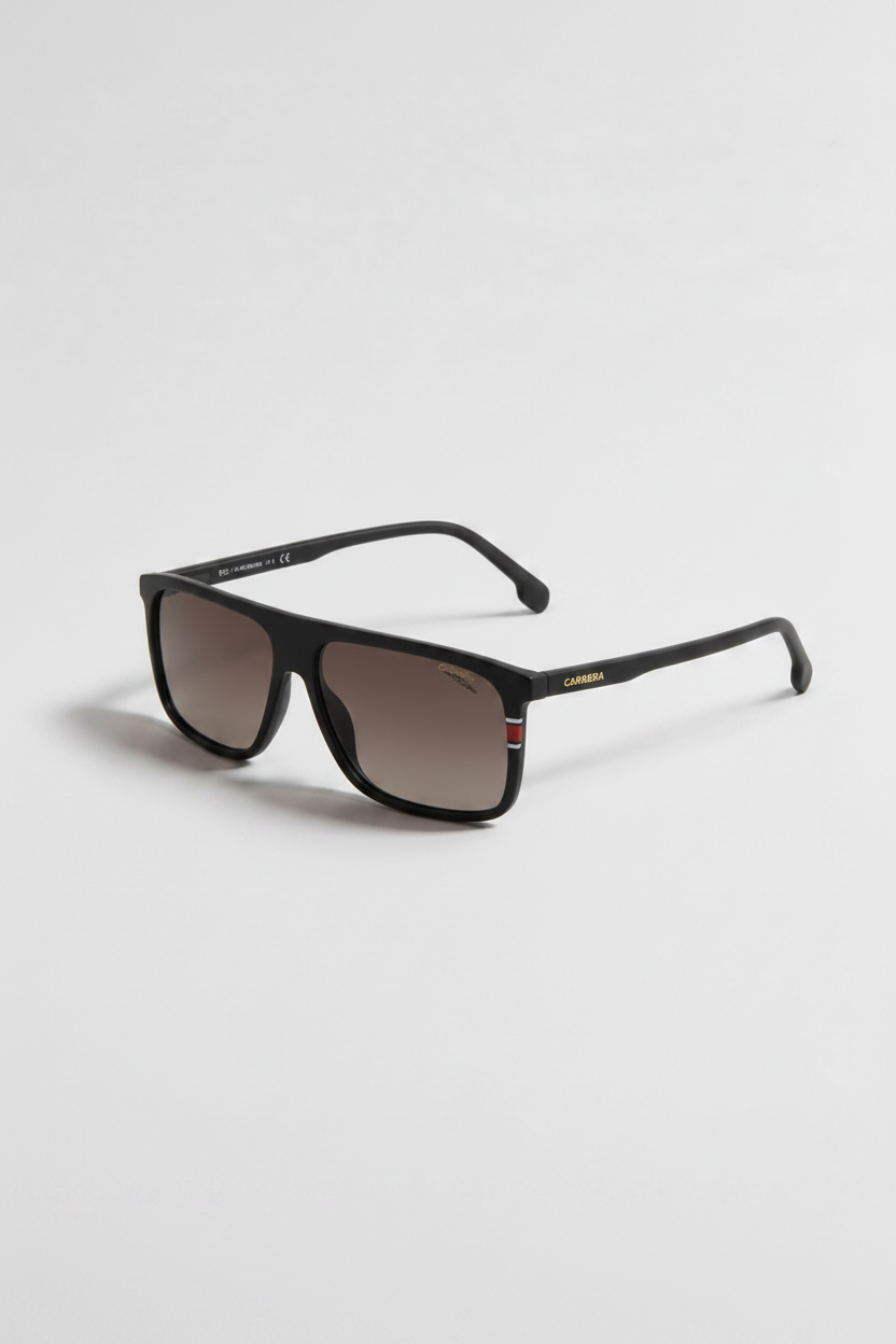 A pair of square-frame sunglasses with a matte black frame and brown tinted lenses, shown on a light gray background. The brand name 'BURGA' is visible in gold lettering on the temple arm.